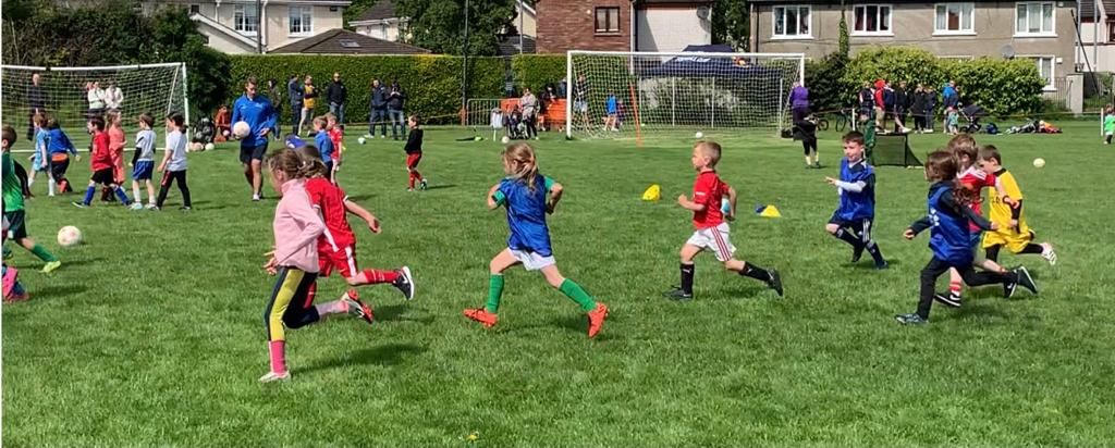 Young children playing a match at RMFC academy. 