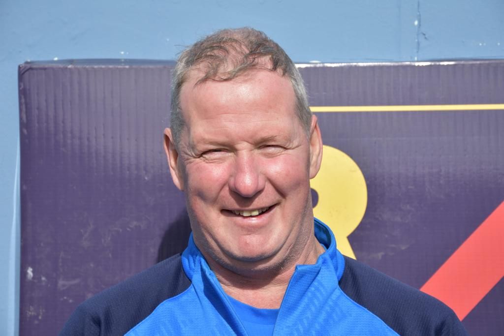 Ger in a Rosemount Mulvey top. He has short grey hair and is clean shaven.